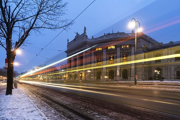 Lights of car trails on the icy road beside the famous Burgtheater (Austrian National