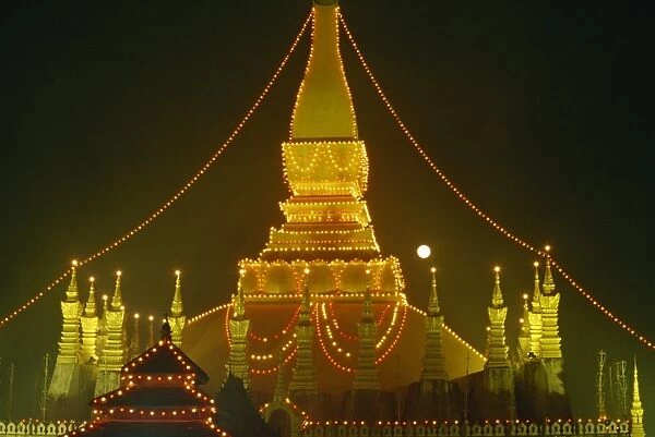 Lights illuminate the Great Stupa of Pha That Luang