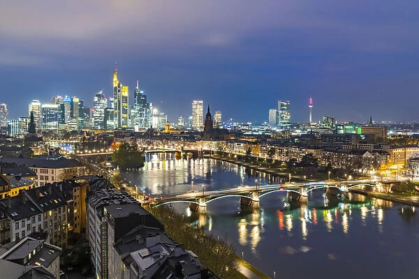 Lights of the Skyline of Frankfurt business district reflected in River Main at dusk, Frankfurt am Main, Hesse, Germany Europe