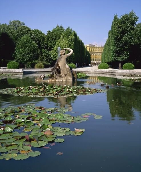 Lily pond and Naiad fountain in the garden of the Schonbrunn Palace, UNESCO World Heritage Site