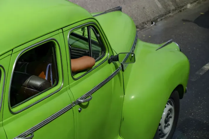 Framed Print : Lime green vintage car with passengers arm through window, Havana, Cuba, West Indies Framed Print : Lime green vintage car with passengers arm through window, Havana, Cuba, West Indies
