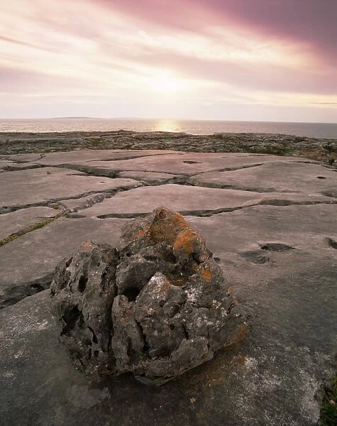 Limestone rocks near the sea at sunset