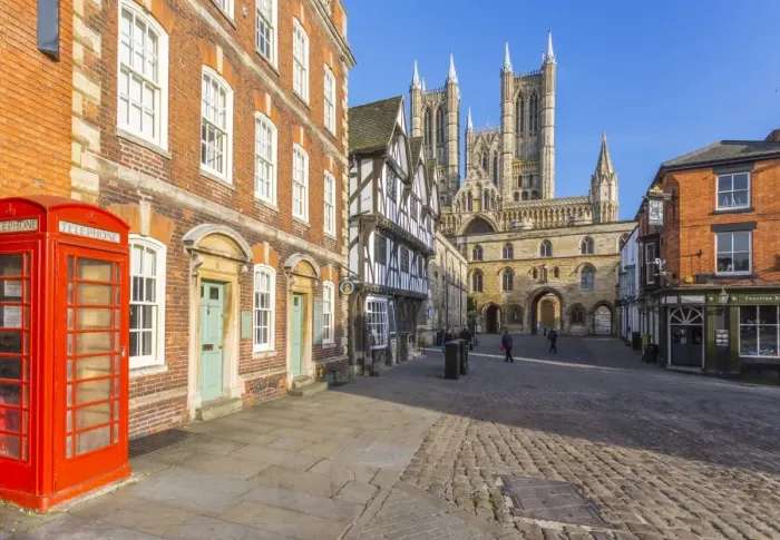Framed Print : Lincoln Cathedral viewed from Exchequer Gate with red telephone visible, Lincoln