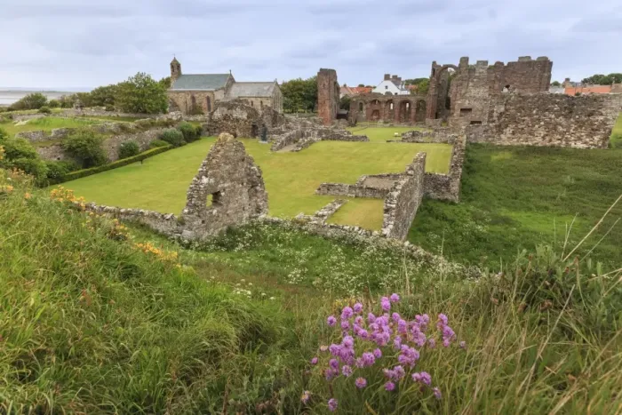 Framed Print : Lindisfarne Priory, early Christian site, and village, elevated view, Holy Island Framed Print : Lindisfarne Priory, early Christian site, and village, elevated view, Holy Island