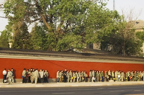 Line of workers waiting to start work in the early morning, Beijing, China, Asia