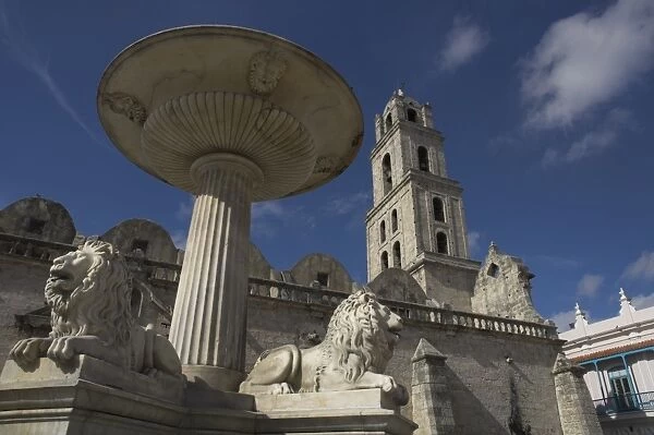 Lion fountain and church beyond, Plaza San Fransisco de Asis, Havana, Cuba