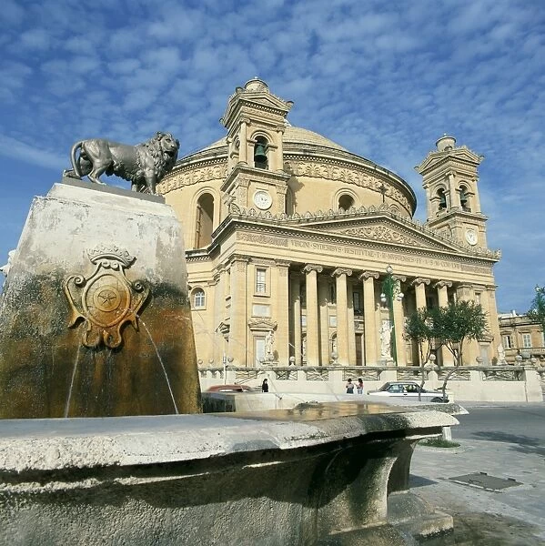 Lion on a fountain in front of the Rotunda church at Mosta