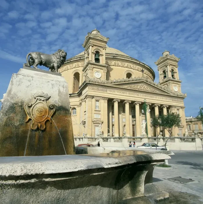 Framed Print : Lion on a fountain in front of the Rotunda church at Mosta Framed Print : Lion on a fountain in front of the Rotunda church at Mosta