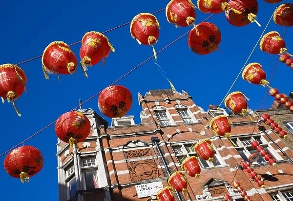 Lisle Street, Chinatown, during the Chinese New Year celebrations, decorated with colourful Chinese lanterns, Soho, London, England, United