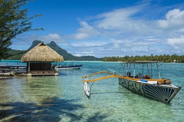 Little boat anchoring on a small Motu, Bora Bora, Society Islands, French Polynesia