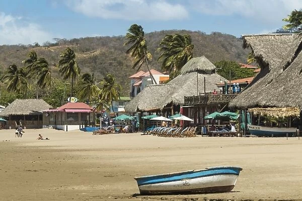 Little boat on the beach at this popular tourist hub for the southern surf coast, San Juan del Sur, Rivas Province, Nicaragua, Central America