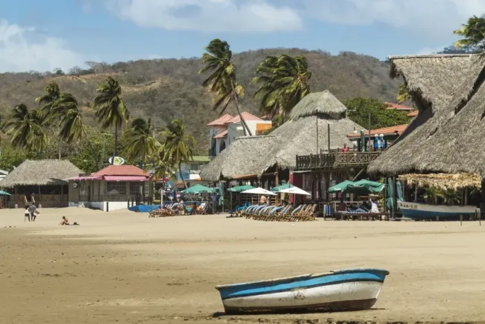 Framed Print : Little boat on the beach at this popular tourist hub for the southern surf coast, San Juan del Sur, Rivas Province, Nicaragua, Central America