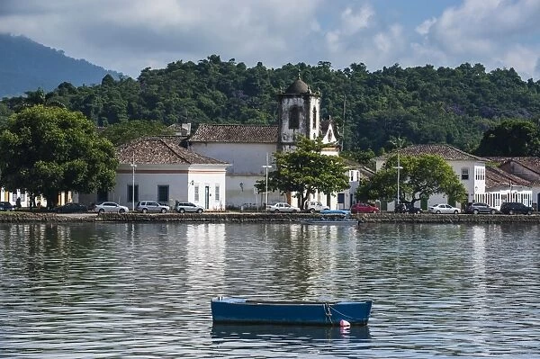 Little boat before a colonial church in Paraty, south of Rio de Janeiro, Brazil, South America