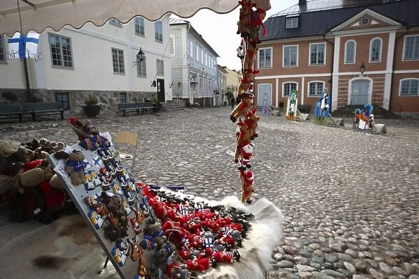 Local handicrafts stall and medieval Town Hall, Old Town Square, Porvoo