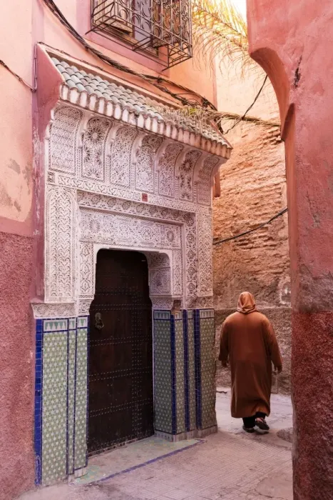 Framed Print : Local man dressed in traditional djellaba walking through street in the Kasbah, Marrakech Framed Print : Local man dressed in traditional djellaba walking through street in the Kasbah, Marrakech