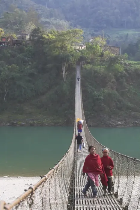 Framed Print : Local people crossing the 160m long suspension bridge Framed Print : Local people crossing the 160m long suspension bridge