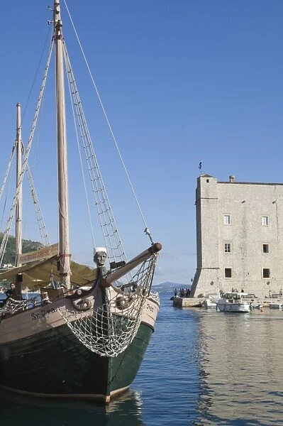 A local tourist boat moored in the old harbour, Old City, Dubrovnik, UNESCO World Heritage Site, Croatia, Europe