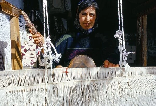 Local weaver spinning wool