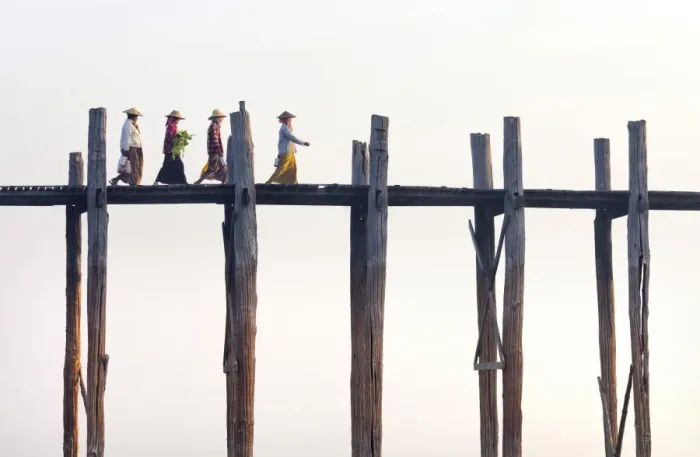 Framed Print : Local women walking across U Bein Bridge behind, the worlds longest teak foot bridge spanning 1300 yards over Taungthaman Lake, Amarapura, near Mandalay, Myanmar (Burma), Asia Framed Print : Local women walking across U Bein Bridge behind, the worlds longest teak foot bridge spanning 1300 yards over Taungthaman Lake, Amarapura, near Mandalay, Myanmar (Burma), Asia