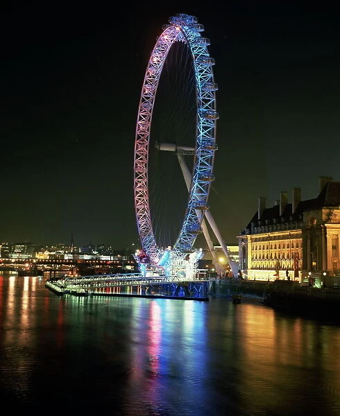 London Eye illuminated by moving coloured lights, London, England, United Kingdom, Europe