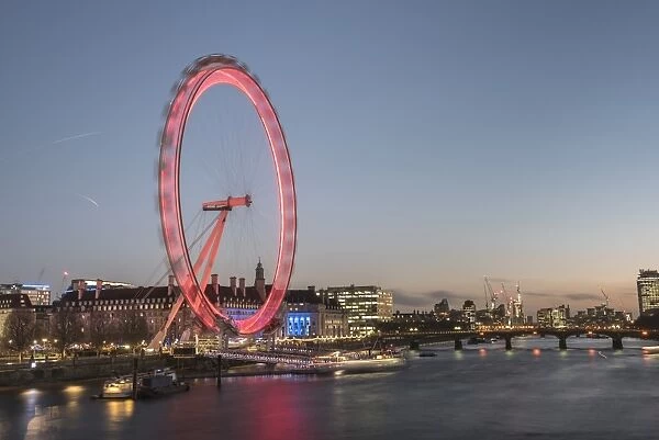 The London Eye at night seen from Golden Jubilee Bridge, London, England, United Kingdom