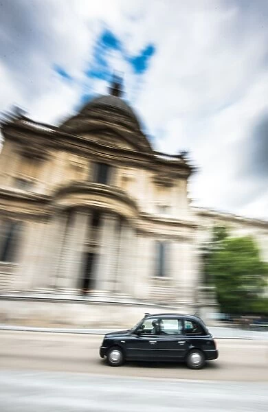 London taxi going past St. Pauls Cathedral, City of London, London, England, United Kingdom