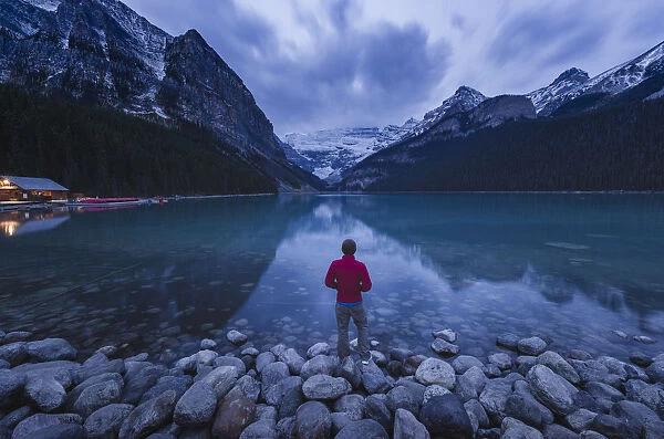 Lone traveler at Lake Louise in the morning, Banff National Park, UNESCO World Heritage Site
