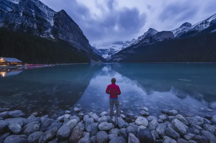 Framed Print : Lone traveler at Lake Louise in the morning, Banff National Park, UNESCO World Heritage Site Framed Print : Lone traveler at Lake Louise in the morning, Banff National Park, UNESCO World Heritage Site