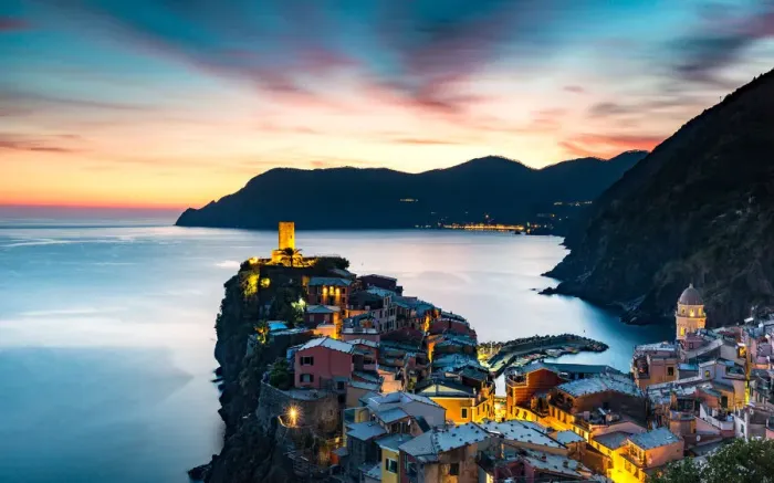 Framed Print : Long exposure at blue hour to capture the end of a stunning sunset and the lights of the old town