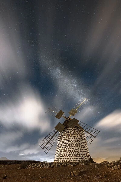 Long exposure image of clouds in the night sky over the old windmill, La Oliva