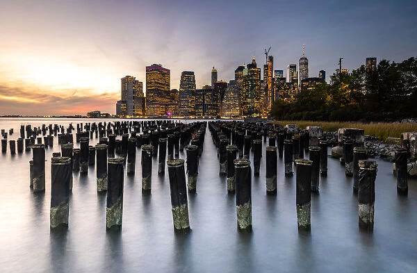 Long exposure of the lights of Lower Manhattan during sunset as seen from Brooklyn Bridge Park