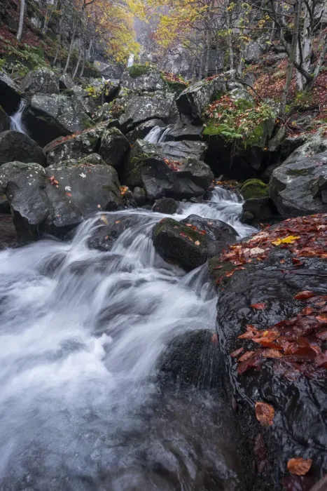 Framed Print : Long exposure of a waterfall flowing between rocks in a wood during autumn, Emilia Romagna, Italy, Europe Framed Print : Long exposure of a waterfall flowing between rocks in a wood during autumn, Emilia Romagna, Italy, Europe