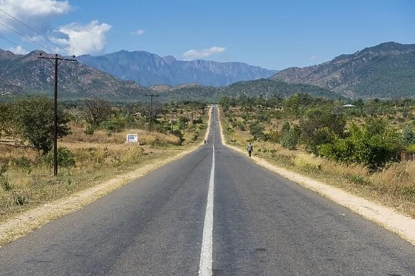 Long straight road in central Malawi, Africa