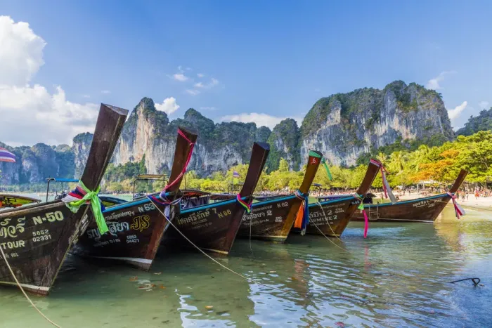 Framed Print : Long tail boats and karst scenery on Railay beach in Railay, Ao Nang, Krabi Province Framed Print : Long tail boats and karst scenery on Railay beach in Railay, Ao Nang, Krabi Province