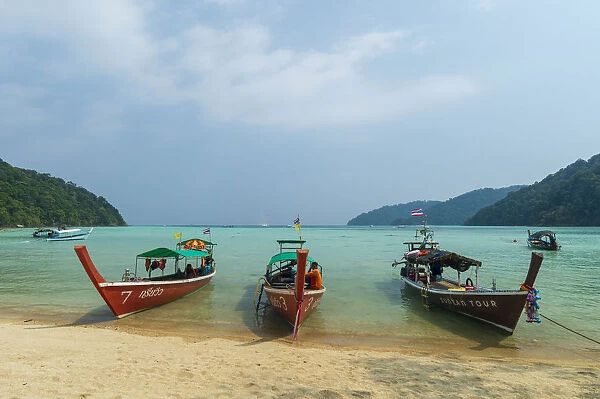 Three long tailed boats on a sandy beach, Thailand, Southeast Asia, Asia