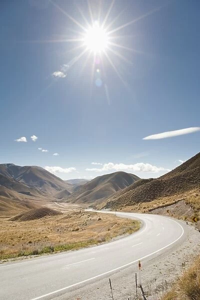 Long winding road through a valley, Otago, South Island, New Zealand, Pacific