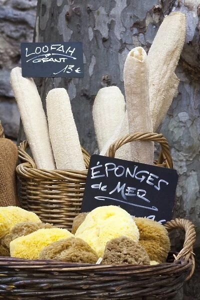 Loofahs and sponges shaped like baguettes and bread in the Saturday market, Ceret, France, Europe