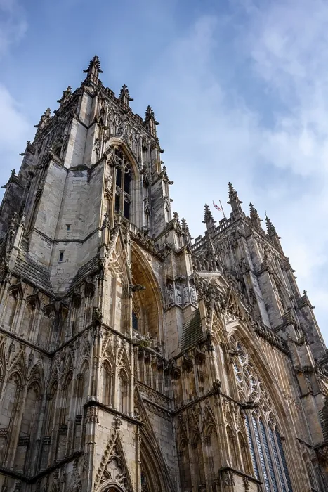 Framed Print : Looking up at the ornate facade and towers of York Minster in the ancient city of York, Yorkshire, United Kingdom Framed Print : Looking up at the ornate facade and towers of York Minster in the ancient city of York, Yorkshire, United Kingdom