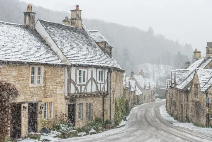 Framed Print : Looking down the quintessential English village of Castle Combe in the snow, Wiltshire
