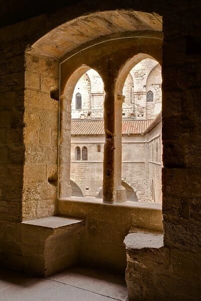 Looking through a window in the Palais de Papes, the palace home to the Sovereign Pontiffs in the 14th century, UNESCO World Heritage Site, Avignon, Vaucluse, France, Europe