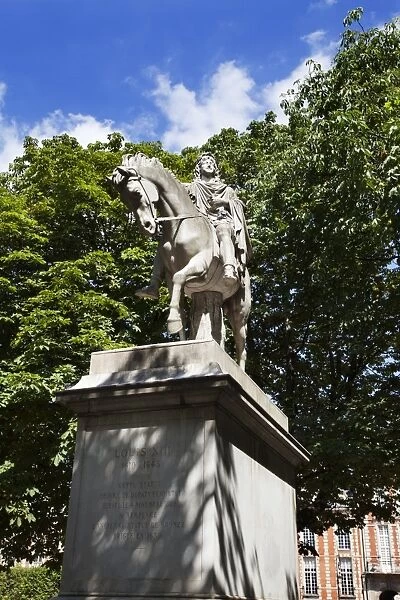 Louis XIII statue in Place des Vosges in The Marais, Paris, France, Europe