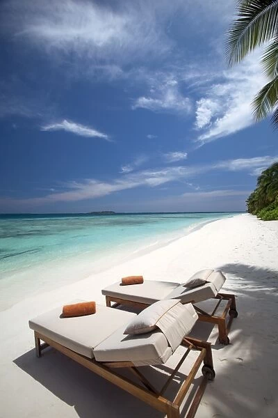 Lounge chairs on tropical beach, Maldives, Indian Ocean, Asia