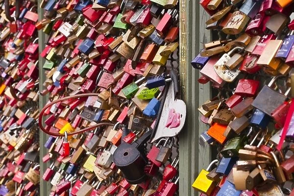 Love locks on the railway bridge in Cologne, North Rhine-Westphalia, Germany, Europe
