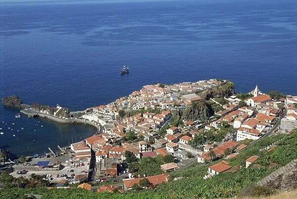 Low aerial view of the coast and the town of Camara