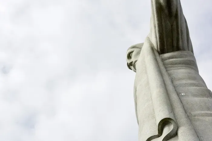 Framed Print : Low angle cropped shot of the iconic statue of Christ the Redeemer on a cloudy day