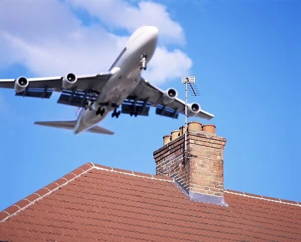 Low-flying aircraft over rooftops near London Heathrow Airport, Greater London