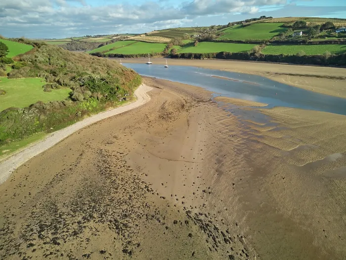 Framed Print : A low tide aerial drone view of the sandy shore and sand banks in the estuary of the River Avon, at Bantham, on the south coast of Devon, Great Britain Framed Print : A low tide aerial drone view of the sandy shore and sand banks in the estuary of the River Avon, at Bantham, on the south coast of Devon, Great Britain