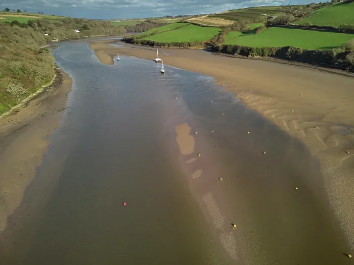 Framed Print : A low tide aerial drone view of the sandy shore and sand banks in the estuary of the River Avon, at Bantham, on the south coast of Devon, Great Britain Framed Print : A low tide aerial drone view of the sandy shore and sand banks in the estuary of the River Avon, at Bantham, on the south coast of Devon, Great Britain