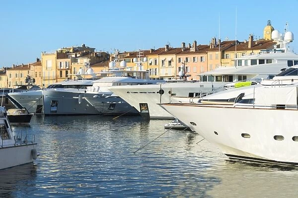 Luxurious motor yachts harboring in the marina of St