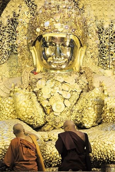 Mahamuni Paya (Mahamuni Buddhist temple), devotees praying and pressing gold leaf